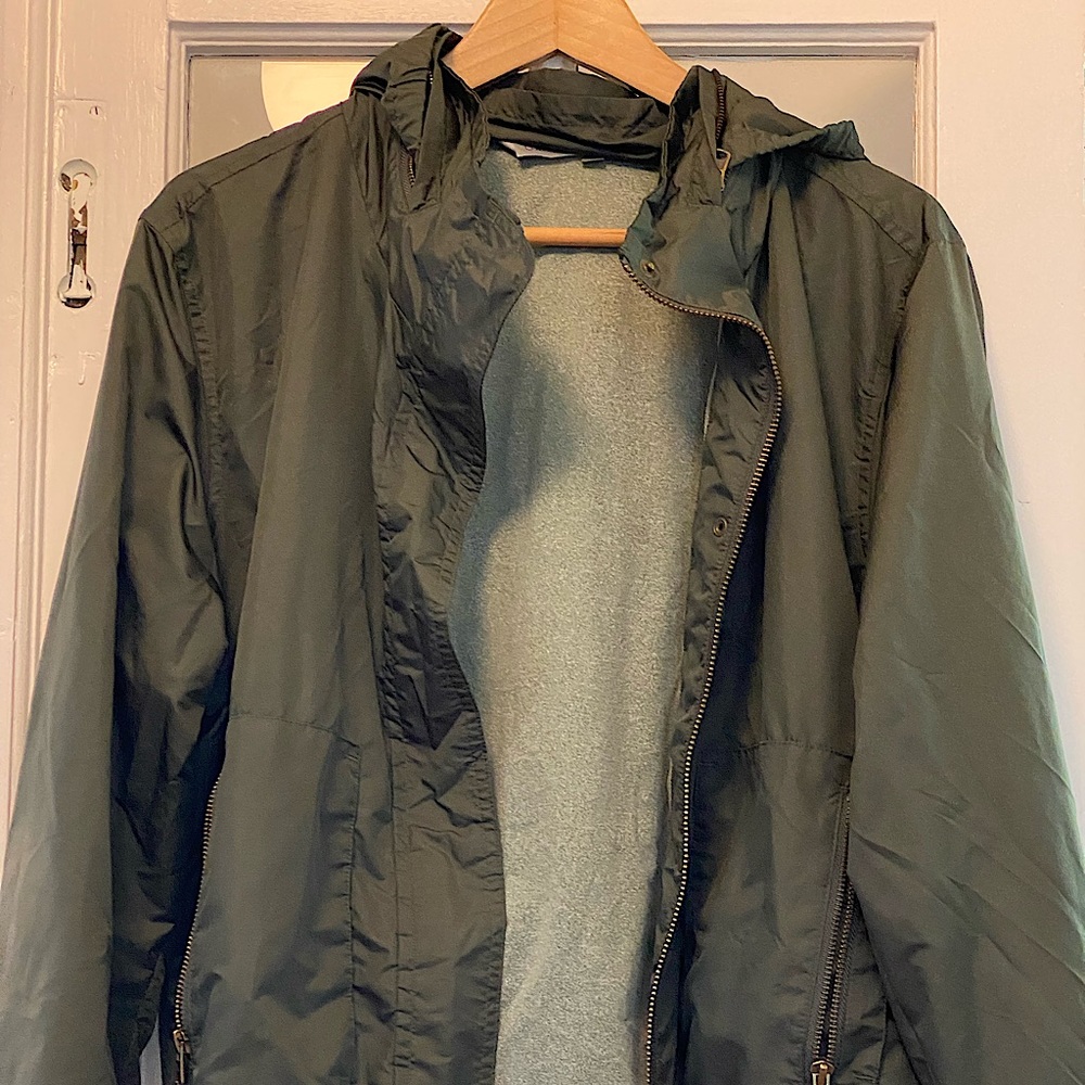 Athleta waterproof jacket. Slight crop, hood zips into the collar. Army green.
